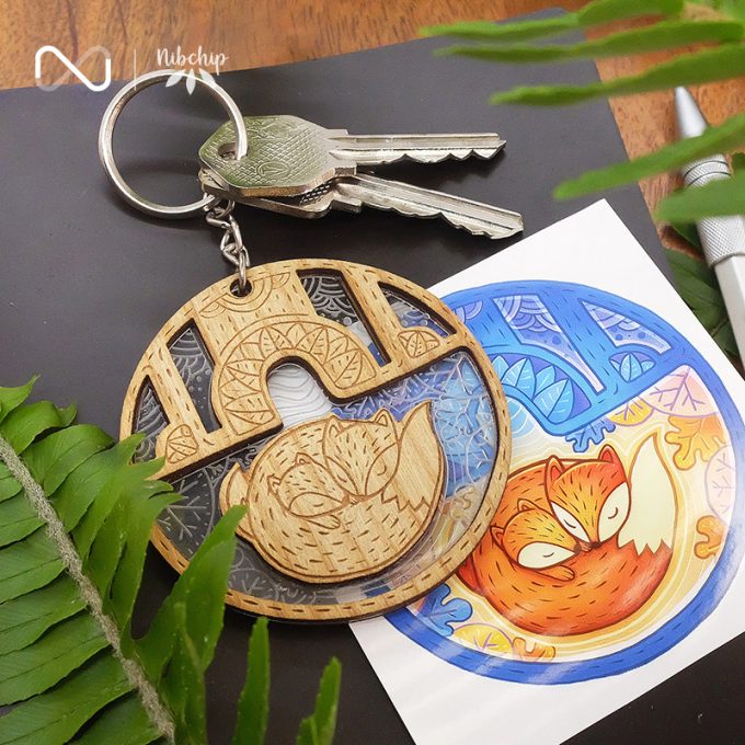 sleeping beauty fox wooden keychain lifestyle