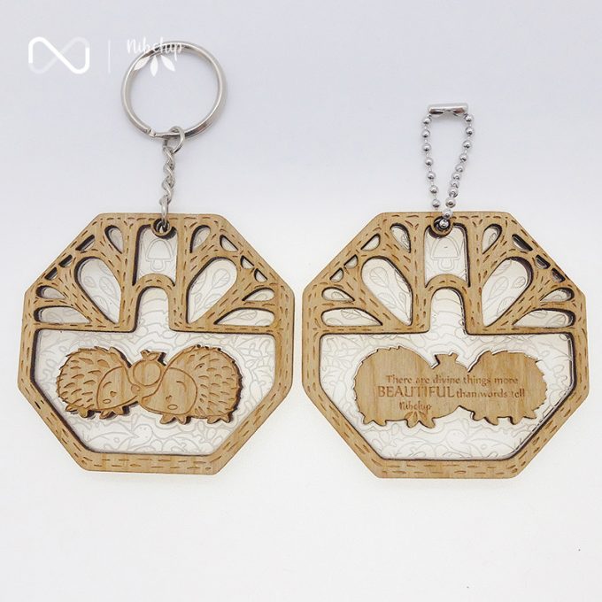 twin hedgehogs wooden keychain front and back topview