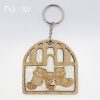 racoon family wooden keychain front