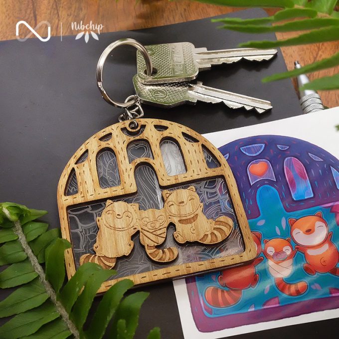 racoon family wooden keychain lifestyle