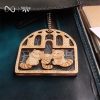 raccoon family wooden keychain on leather bag